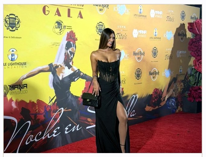 Guest posing at the Hearts and Stars Gala Una Noche en Sevilla step and repeat