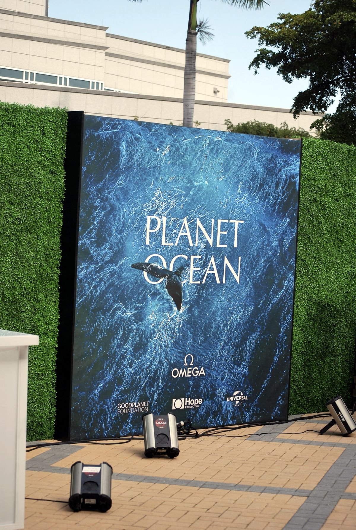 Omega Planet Ocean campaign backdrop with GoodPlanet Foundation and Universal