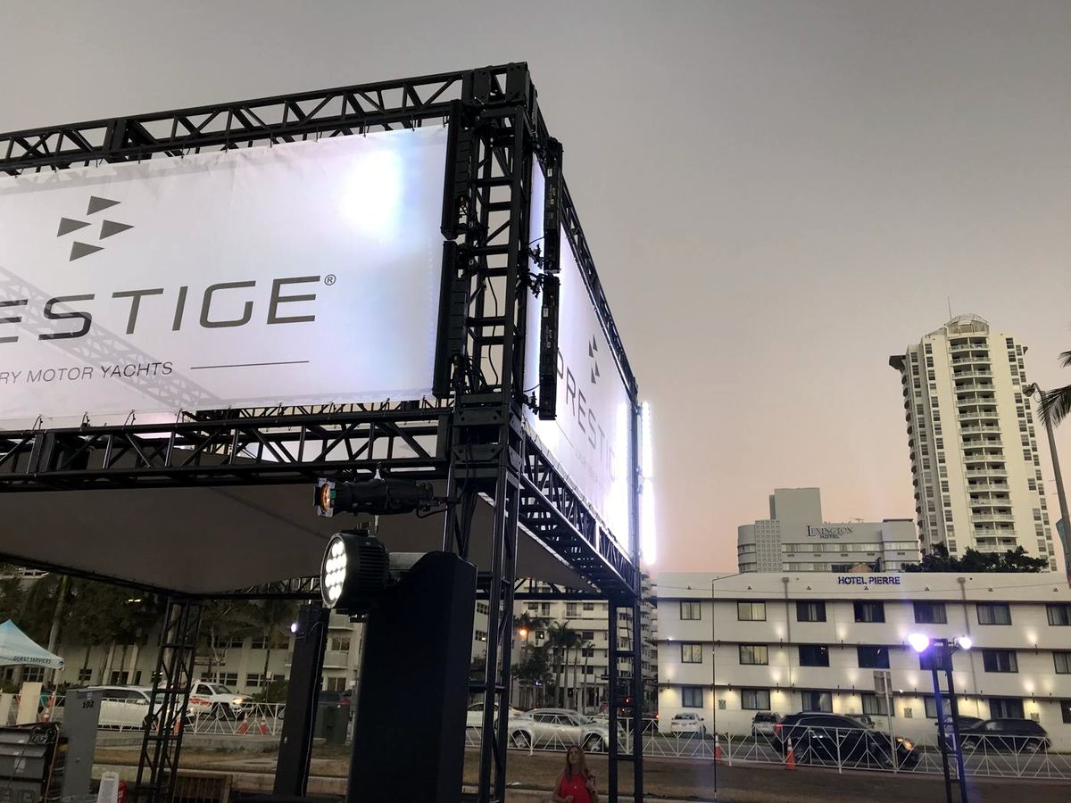 A three-story, front-lit mesh tower against the Miami skyline