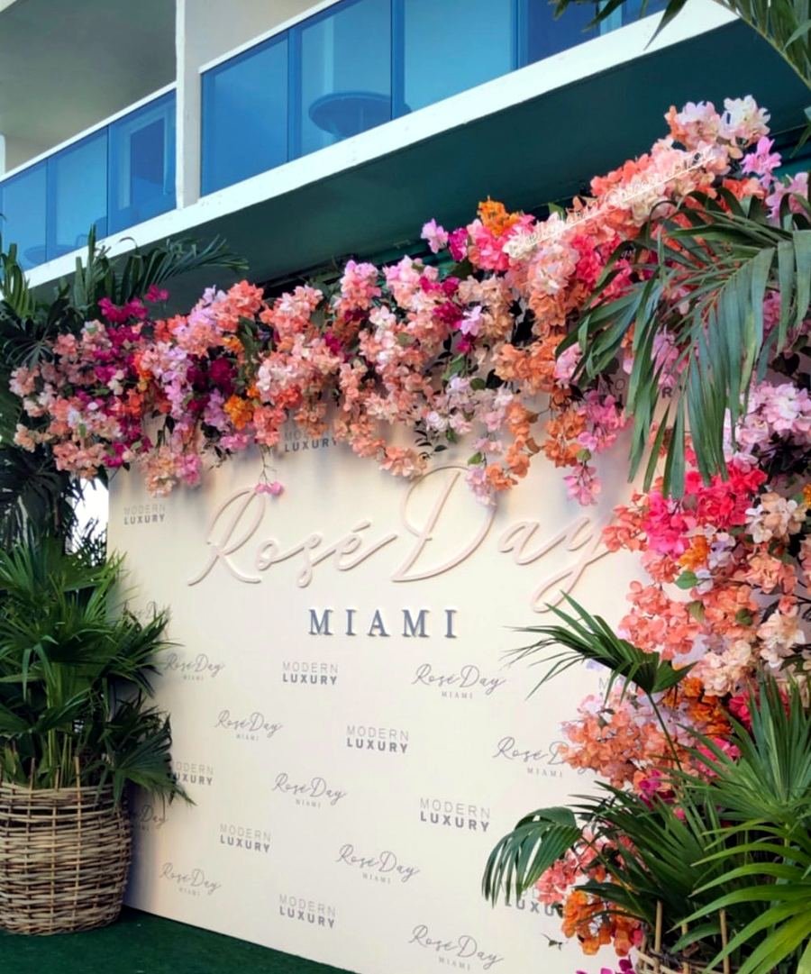 Rosé Day Miami step and repeat with floral installation